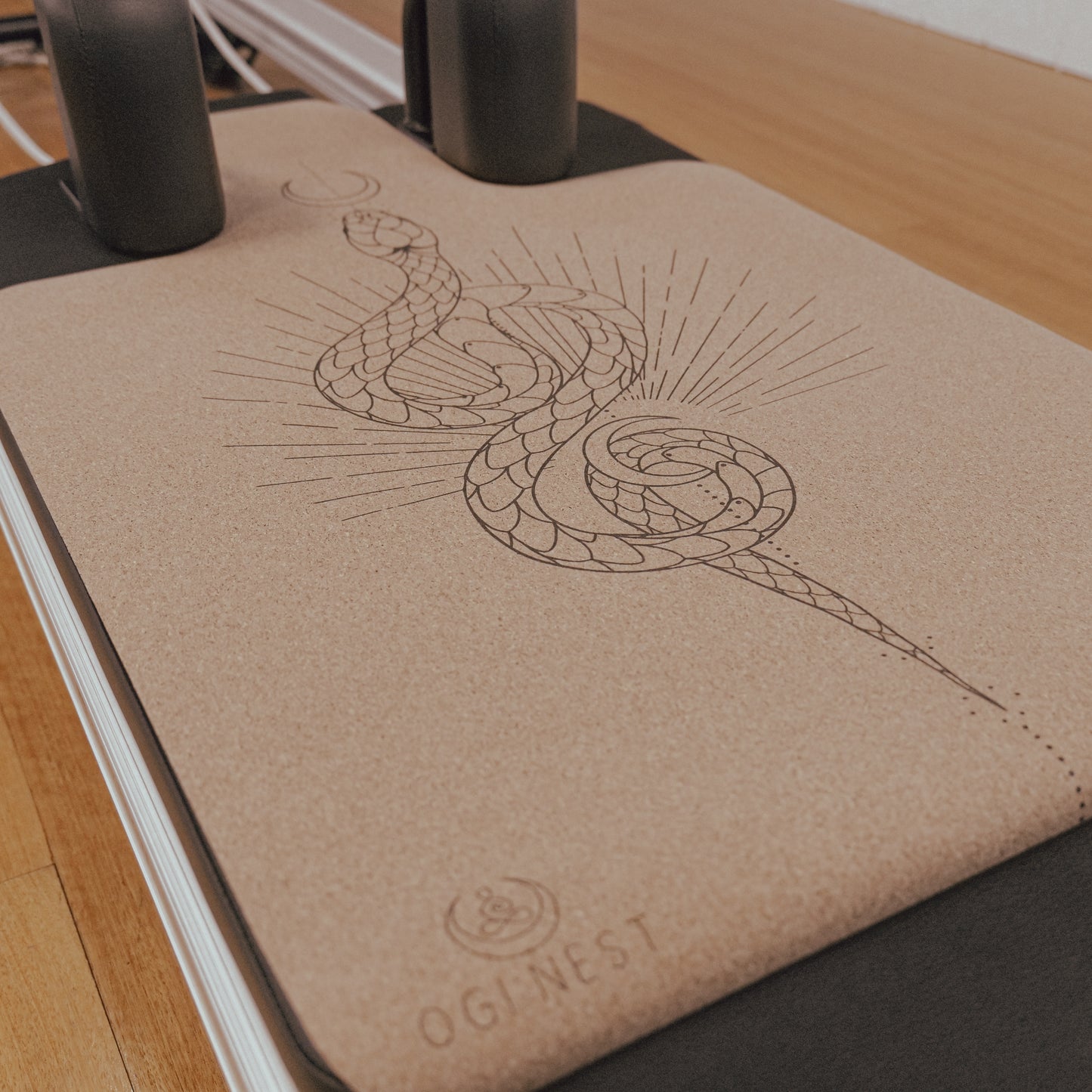 Moon serpent cork and natural rubber Pilates reformer mat.